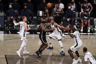 James Harden #13 of the Brooklyn Nets shoots against Giannis Antetokounmpo #34 of the Milwaukee Bucks.